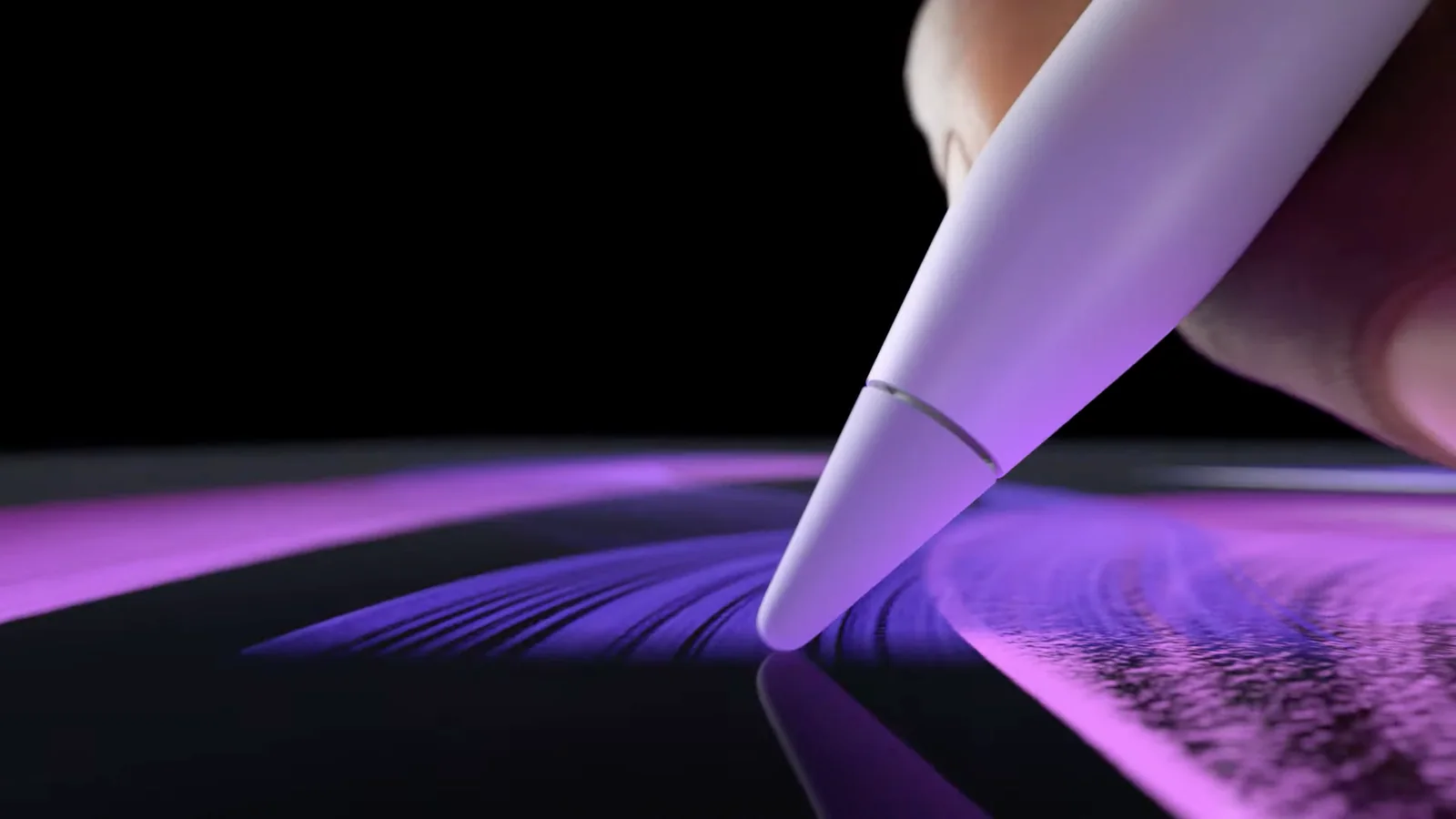 A stylus tip drawing violet strokes on a tablet screen